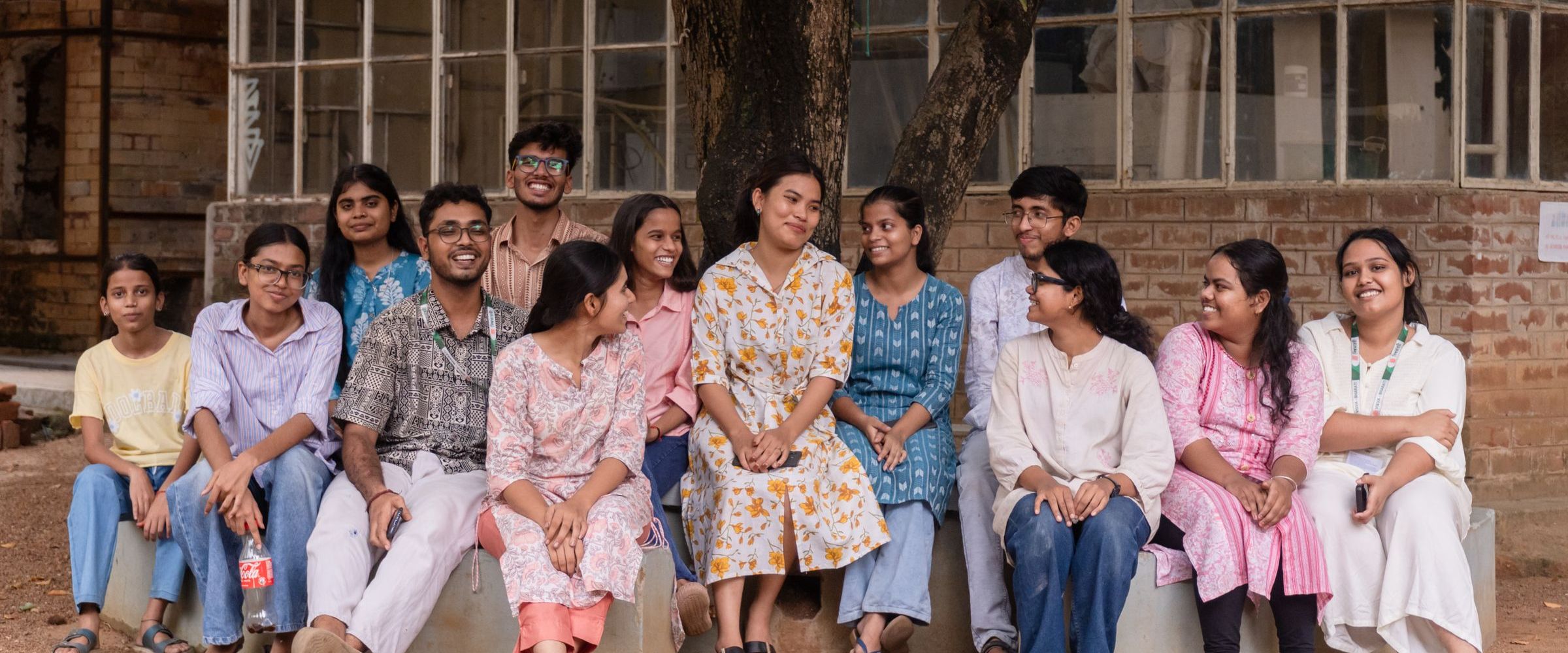 A group of Indian college students sitting together on campus