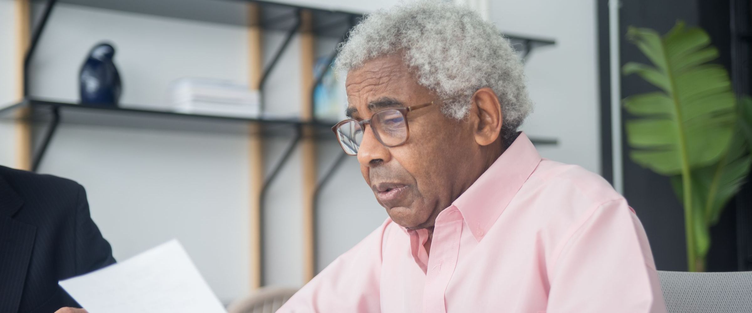 An older client reading through a document